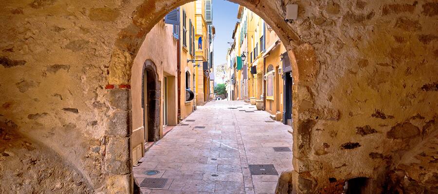 View of narrow path town gate